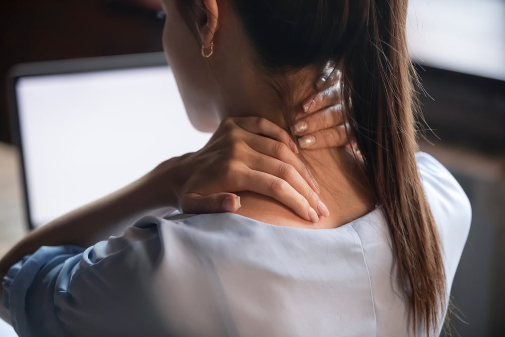 young woman experiencing neck pain