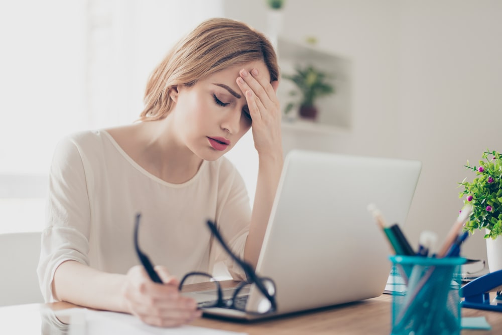 young woman suffering from a migraine